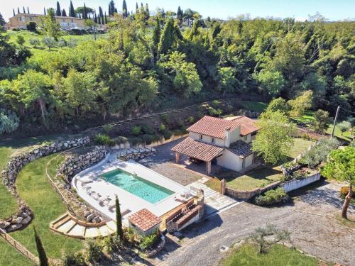 an aerial view of a house with a swimming pool at Villa Oliva by Interhome in Querce