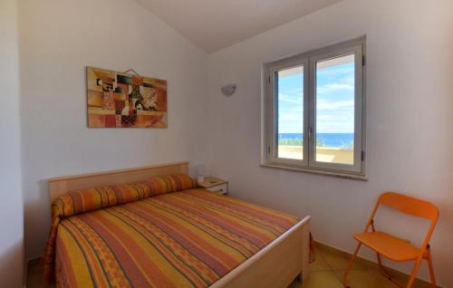 En eller flere senge i et værelse på Villa Maria Carmela