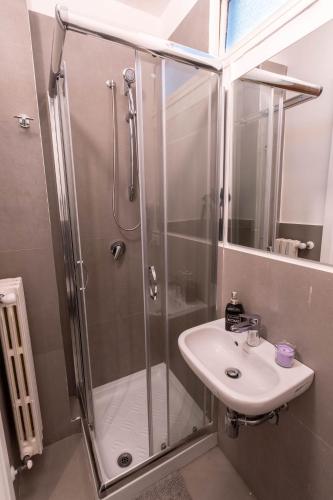 a bathroom with a shower and a sink at Daniel's Apartment in Bari