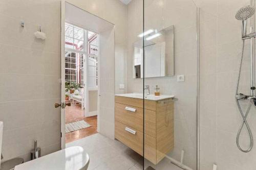 a white bathroom with a shower and a sink at Valls De Quintana Casa Emblemática Arrecife in Arrecife