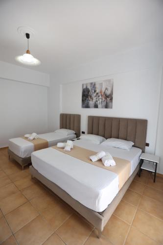 Cama o camas de una habitación en Hotel de Ksamil