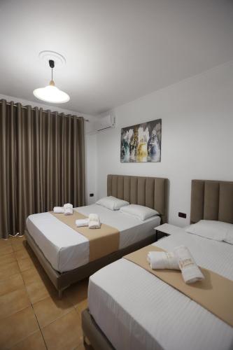 Cama o camas de una habitación en Hotel de Ksamil