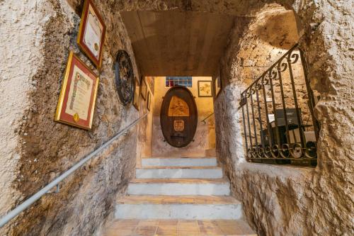 a staircase leading to a door in a stone building at Arzenhof, Baron Di Pauli in Caldaro