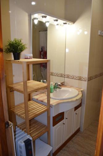 a bathroom with a sink and a mirror at Casa Rural Natalia in Valmuel