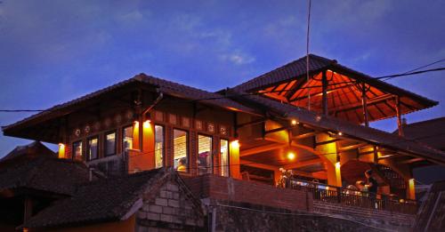 a large building with lights on top of it at Guru Ratna in Munduk