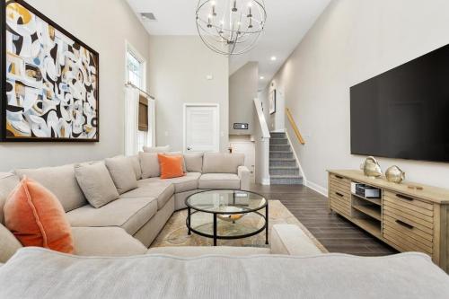 a living room with a couch and a flat screen tv at Balcony View, Updated Interior, Close to the Beach! in Atlantic City