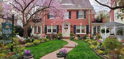 a brick house with a garden in front of it at Pettigru Place Bed & Breakfast in Greenville