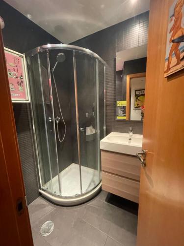 a bathroom with a shower and a sink at Loft en el mercado del Fontan in Oviedo