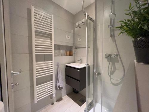 a bathroom with a shower and a sink at Center Beach Apartament, Split, Croatia in Split