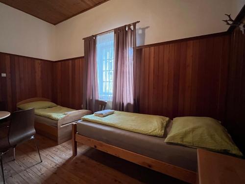 Säng eller sängar i ett rum på Ferienhaus ZUR ALTEN FORSTKANZLEI