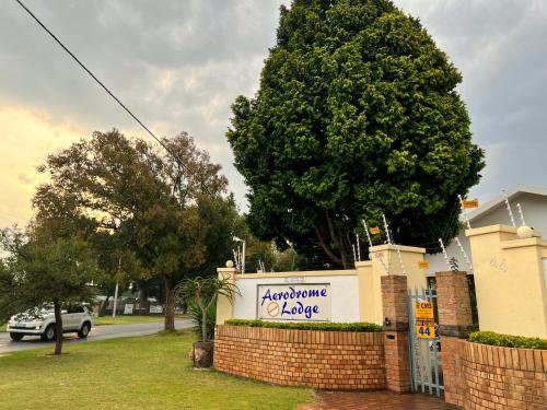 a sign for a welcoming envelope on a house at Aerodrome Lodge and Conference Centre in Benoni