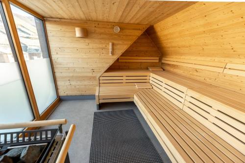 a sauna with wooden walls and benches in a room at DEINHARD's in Bernkastel-Kues