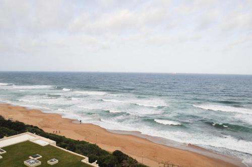 an aerial view of a beach and the ocean at 802 The Bermudas - by Stay in Umhlanga in Durban