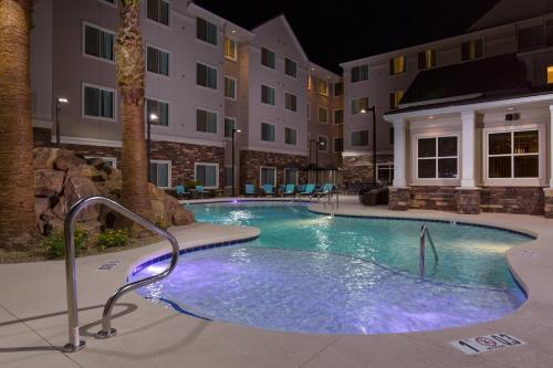 a swimming pool in a hotel at night at Residence Inn by Marriott Las Vegas Airport in Las Vegas
