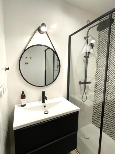 a bathroom with a sink and a mirror at Zatoka spokoju in Gdynia