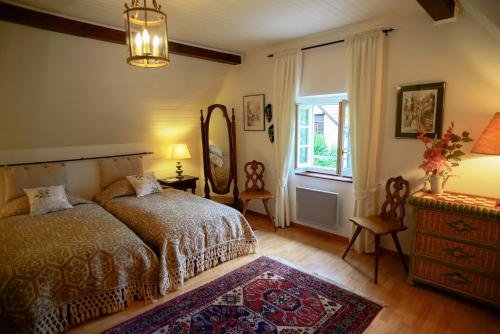 Postel nebo postele na pokoji v ubytování Gîte du Windstein