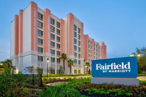 a hotel sign in front of a building at Fairfield by Marriott Inn & Suites Orlando at FLAMINGO CROSSINGS® Town Center in Orlando