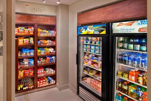 two refrigerators in a grocery store with food and drinks at Residence Inn Orlando Lake Mary in Lake Mary