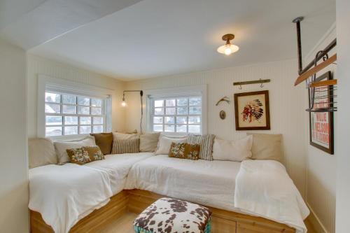 a living room with two beds and a couch at Historic Albion Mountain Cottage on Quiet Street! in Albion