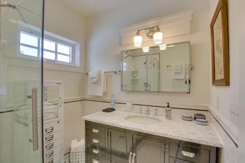 a bathroom with a sink and a shower and a mirror at Historic Albion Mountain Cottage on Quiet Street! in Albion