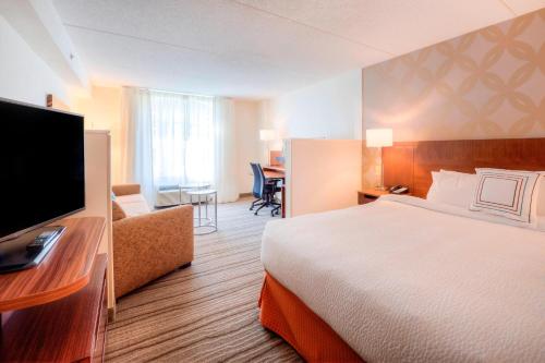 a hotel room with a bed and a television at Fairfield Inn & Suites by Marriott Winston-Salem Downtown in Winston-Salem