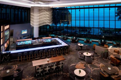 an aerial view of a restaurant with a bar at San Francisco Airport Marriott Waterfront in Burlingame
