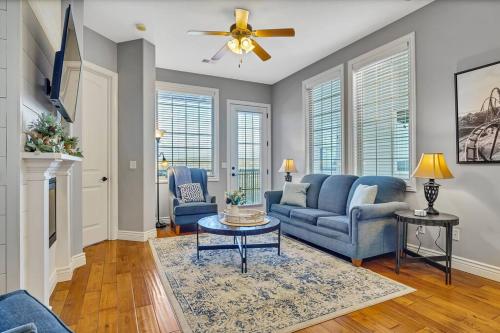 a living room with a blue couch and a table at WALK IN Two bed Lakeview at Indian Point in Branson