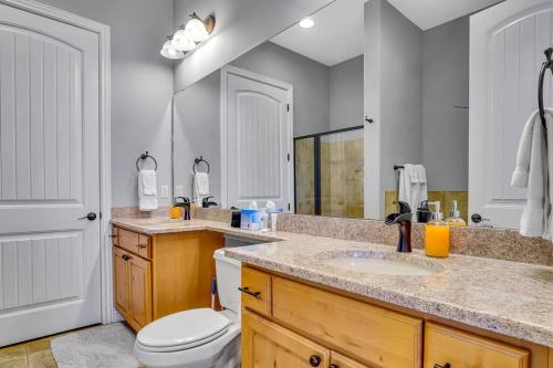 a bathroom with a sink and a toilet in it at WALK IN Two bed Lakeview at Indian Point in Branson