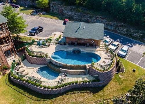 an overhead view of a swimming pool with a house at WALK IN Two bed Lakeview at Indian Point in Branson