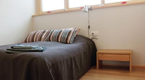 מיטה או מיטות בחדר ב-Otepää Holiday Home