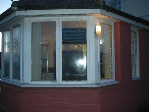 a window on the side of a red building at Lynebank House Hotel, Bed & Breakfast in Carlisle