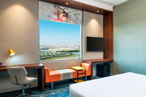 Aloft Dubai South -  Room  picture :   Tea/Coffee maker    Minibar    Shower                           