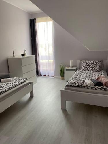 Ένα ή περισσότερα κρεβάτια σε δωμάτιο στο Star Apartman