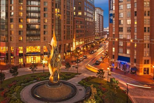 a statue in the middle of a city with buildings at Courtyard by Marriott Baltimore Downtown/Inner Harbor in Baltimore