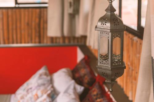 a lamp hanging from a wall in a room at Casa Amberes in Honda