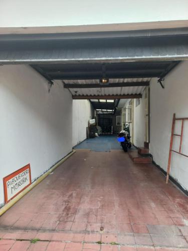 an empty garage with a motorcycle parked in it at Hostal Morobik Ancestral in Popayan
