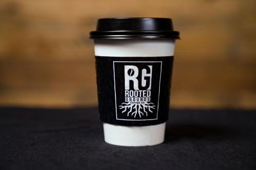 a black and white coffee cup sitting on a table at Phoenix Marriott Resort Tempe at The Buttes in Tempe
