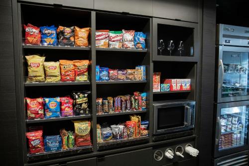 a refrigerator filled with lots of different types of snacks at Courtyard by Marriott Greenville Mauldin in Greenville