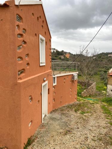 a building with a lot of climbing equipment on the side at Pulchra Campis,Private Pool,Wifi,Parking in Nerokoúros