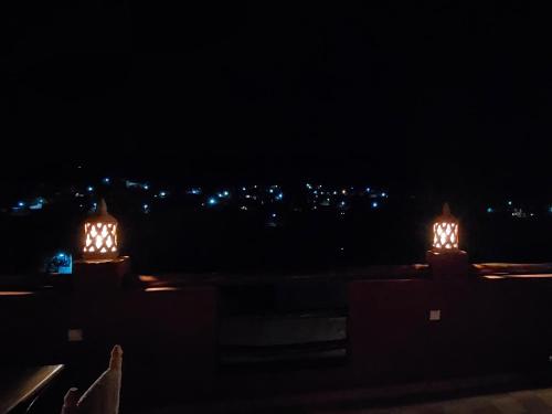 a view of a city at night with lights at Ouirgane discovery lodge in Ouirgane