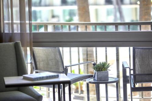a laptop computer sitting on a table in front of a window at Los Angeles Airport Marriott in Los Angeles