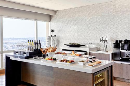 a kitchen with several plates of food on a counter at Los Angeles Airport Marriott in Los Angeles
