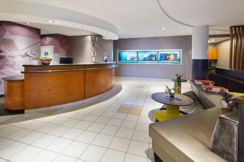 a lobby of a hospital with a waiting room at SpringHill Suites by Marriott Denver Airport in Denver
