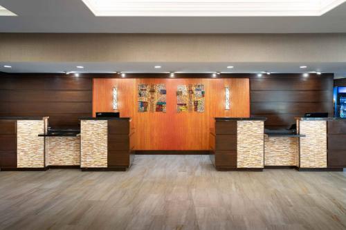 a lobby with wood paneled walls and wooden doors at DoubleTree by Hilton Minneapolis Airport, MN in Bloomington