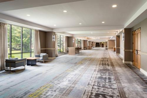 an empty lobby with a rug on the floor at DoubleTree by Hilton Minneapolis Airport, MN in Bloomington