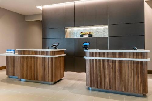 a dental office with two reception desks and sinks at Courtyard by Marriott Fort Lauderdale Downtown in Fort Lauderdale