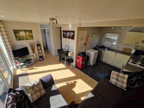 an aerial view of a living room and kitchen at 60 upperlakeside glan gwna in Caernarfon