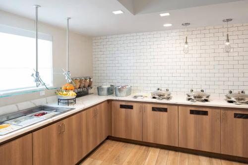 a kitchen with wooden cabinets and a sink at Residence Inn by Marriott Las Vegas Convention Center in Las Vegas
