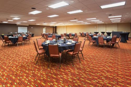 a conference room with tables and chairs in it at Courtyard Grand Junction in Grand Junction