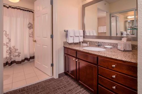 a bathroom with a sink and a large mirror at Residence Inn Alexandria Old Town/Duke Street in Alexandria